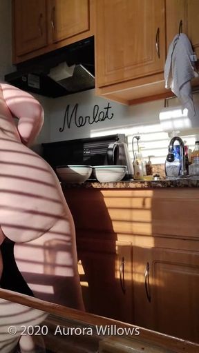 Nude making breakfast on vacation
