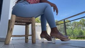 Teen tapping legs in high heels and tight leggings