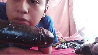 Putito enjoys his toy in his bed