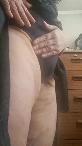 The pussy is very hairy, the hair is sticking out of the panties.