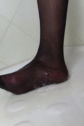 Redhead tranny in sexy stockings  pissing on feet in the bathroom