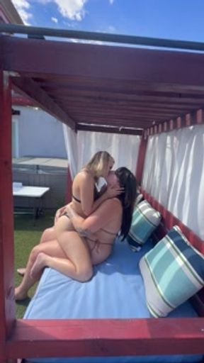 Lesbians making out before fucking outside in pool cabana