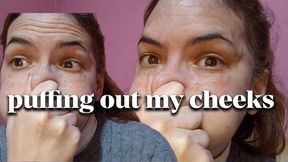 I puff out my cheeks and squeeze them with my hands!