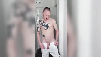 Twink in white trackies shows off his big cock and jerks off