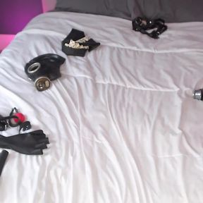 Latex doll playing with her rubber strapon cock and dildo gag