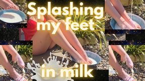 Splashing milk with my feet outdoors