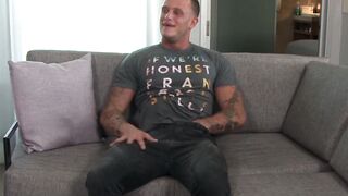 Buff military gay strips on the couch and jerks his dick off