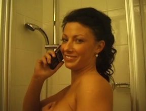 Super hot brunette is taking a shower