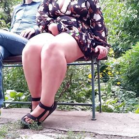 Slutty mother-in-law spreads her legs wide to pee in a public park