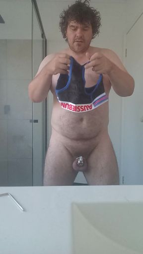 Bear locking up for the day in chastity