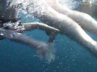 Stripped angels on Tenerife having joy in the water