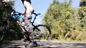 Slim boy with his bike in the park