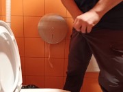 pee in a public orange toilet