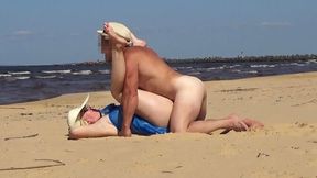 Amateur blonde MILF couples up on the beach for some romantic missionary fun
