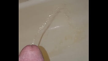 Marking my shower with a full bladder and an erection.