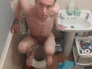 Skinny teen Having fun in bathroom pissing in toilet and putting his head inside of it
