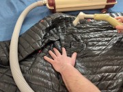 Vacuuming Dark Shark Ghost Whisperer Down Jacket with Vintage Electrolux Vacuum Cleaner