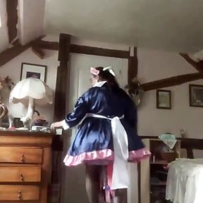 In a blue and pink maid outfit for a day