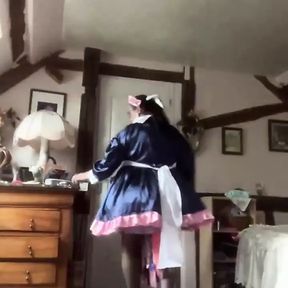 In a blue and pink maid outfit for a day