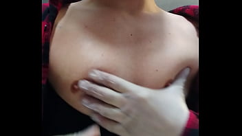 Dreamy feminine man playing with boobs