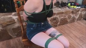 Izzie tied to a chair stripped and gagged