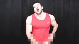 Muscular hunk in lycra strokes his hard cock solo