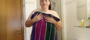 Curvy German MILF showers chubby hubby under the water