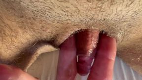 Pleasurable masturbation of a trans man's penis until orgasm