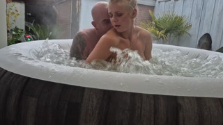 Intimate and passionate fun and play in an outdoor jacuzzi