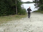 wetsuited silicone masked man on patrol near lake