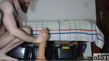 Man with shaved body having fun with his toys