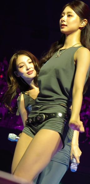 Leggy Asian babe shows off her thick thighs in a K-pop inspired pose