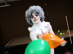 A clown dressed babe teasing amateur style