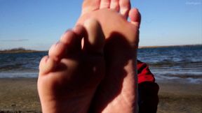 Jackies Feet lures Feet Goat to the beach for a sneaky footjob and blowjob with cumshot in mouth