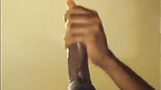 Black boy faps off his hefty salami and shoots a load firm