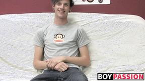 ”Cute gay guy Danny jerks off his cock on couch solo”