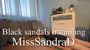 Black sandals trampling