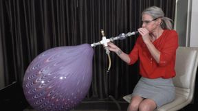 Kody Blows a Suzuki Peacock Balloon to Bursting (MP4 - 1080p)