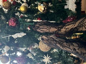 Playing with a christmas three with my legs in stockings