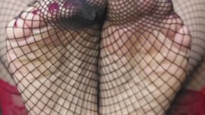 Here’s a descriptive and Sensual Textures: Fishnets, Oil, and Bare Skin