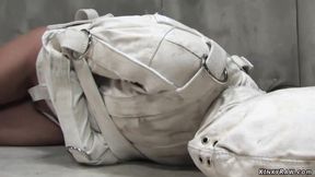 ”Brunette psycho bound in straitjacket”