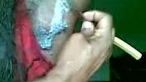 Anonymous raven-haired whore shaves her hairy armpits