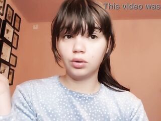 Brunette with natural big lips with natural color lipgloss smokin' a cigarette blowing smoke in your face