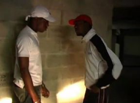 Two well-mounted blacks in a housing estate parking lot