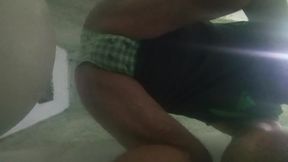 Showing it with green panties.