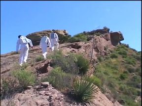 Astronaut stud lands on a planet where a blonde primitive babe sucks his cock outdoors