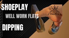 Just dangling, dipping, well worn flats