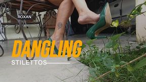 Stiletto heels dangling from a beautiful woman's feet (3)