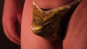 playing with my bulge in a tiny yellow satin thong
