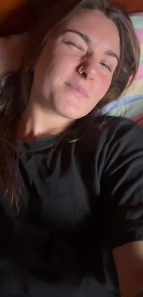 Lusty amateur GF plays with her big tits while lying down